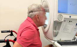 A patient in wheelchair doing a visual field test
